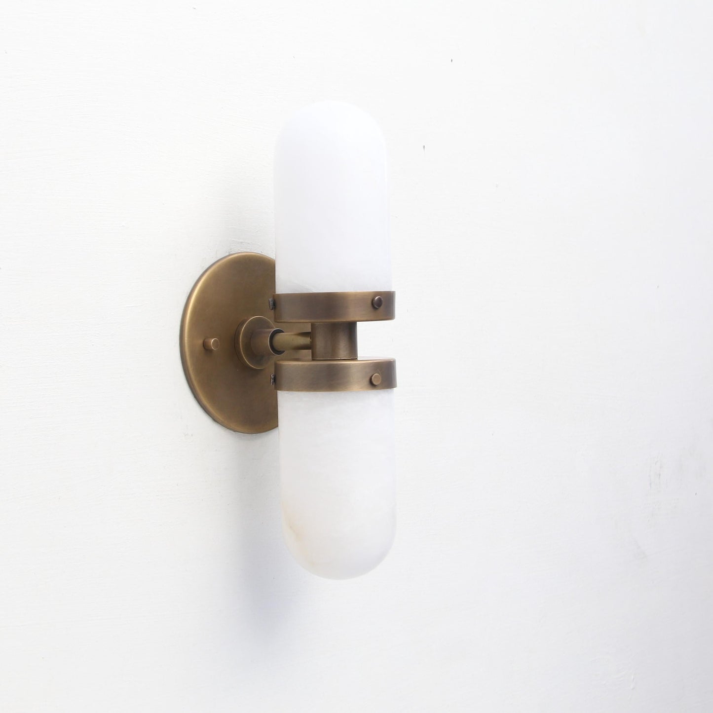Two-Light Brass Wall Sconce with Clamped Alabaster Capsules