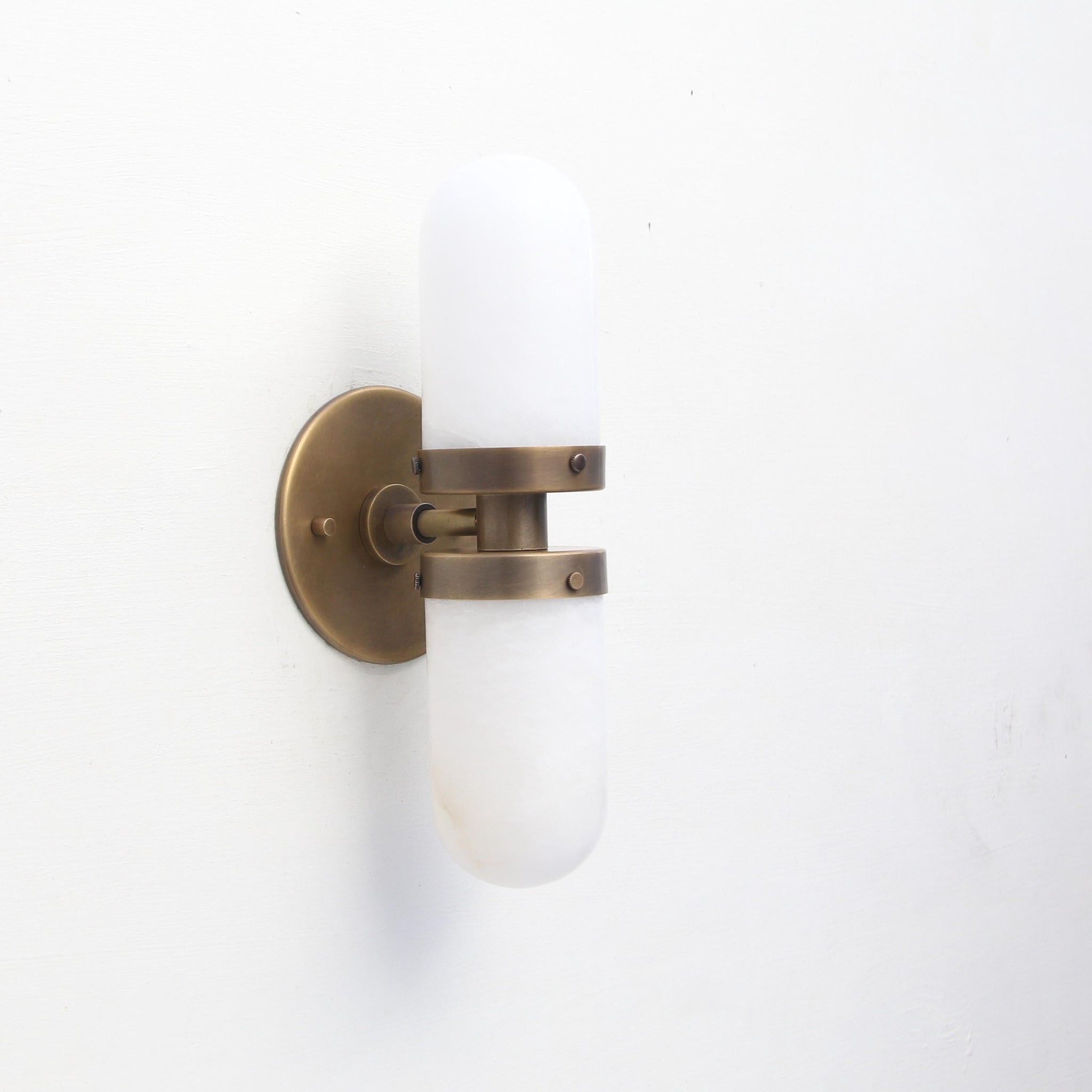 Two-Light Brass Wall Sconce with Clamped Alabaster Capsules