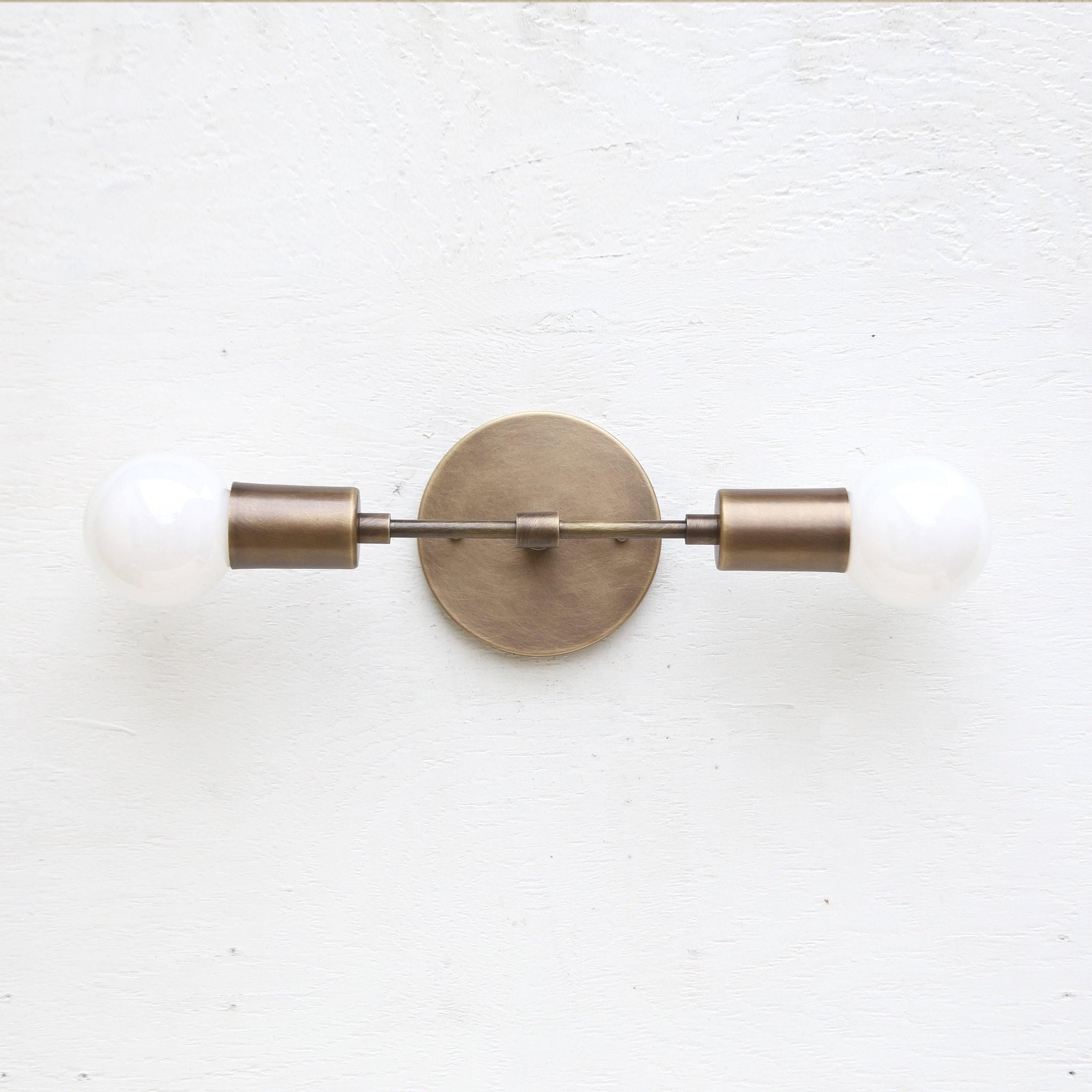 Two-Light Brass Wall Sconce with Exposed Bulbs