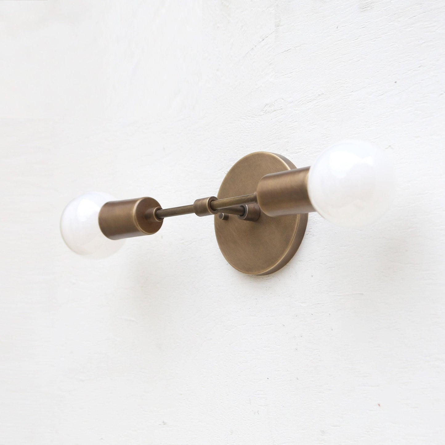 Two-Light Brass Wall Sconce with Exposed Bulbs