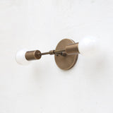 Two-Light Brass Wall Sconce with Exposed Bulbs