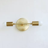 Two-Light Brass Wall Sconce with Exposed Bulbs