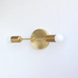Two-Light Brass Wall Sconce with Exposed Bulbs
