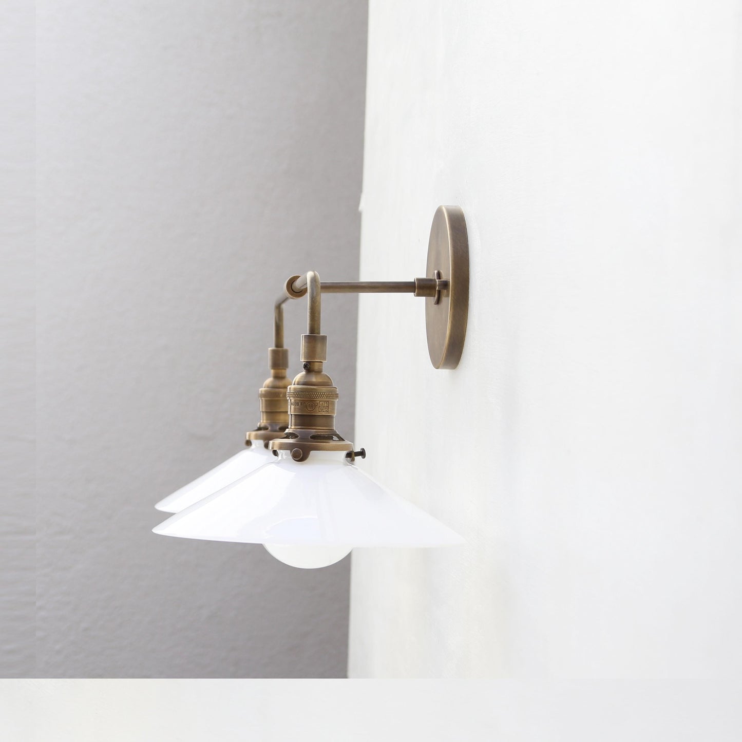 Two-Light Brass Wall Sconce with Opal Glass Cone Shades