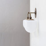 Two-Light Brass Wall Sconce with Opal Glass Globe Shades