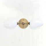 Two-Light Brass Wall Sconce with Opal Tulip Shades