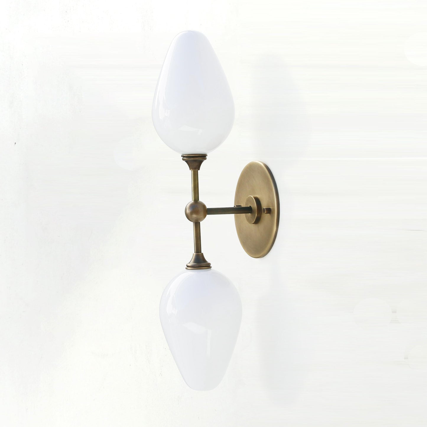 Two-Light Brass Wall Sconce with Opal Tulip Shades