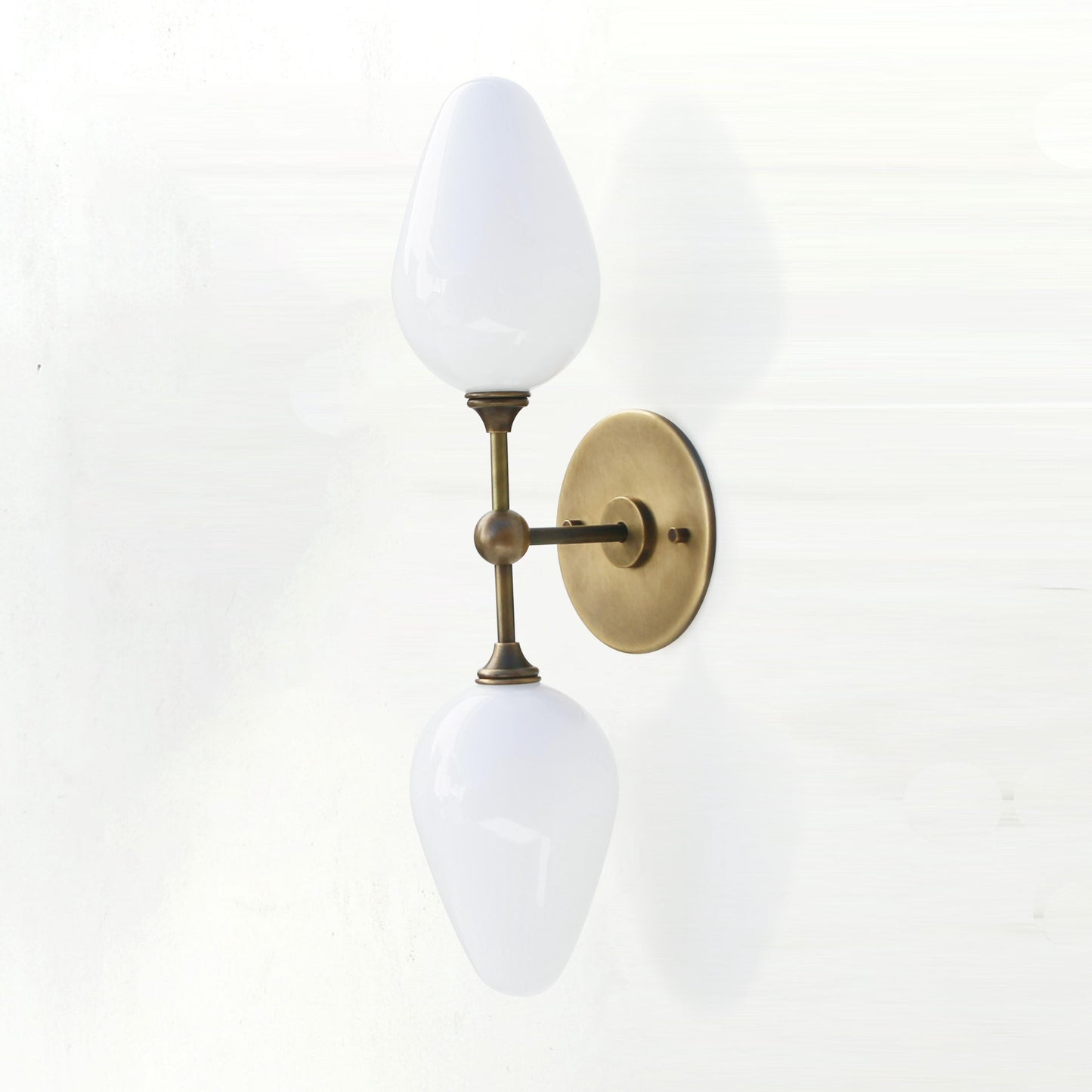 Two-Light Brass Wall Sconce with Opal Tulip Shades
