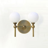 Two-Light Brass Wall Sconce with Ribbed Opal Globes