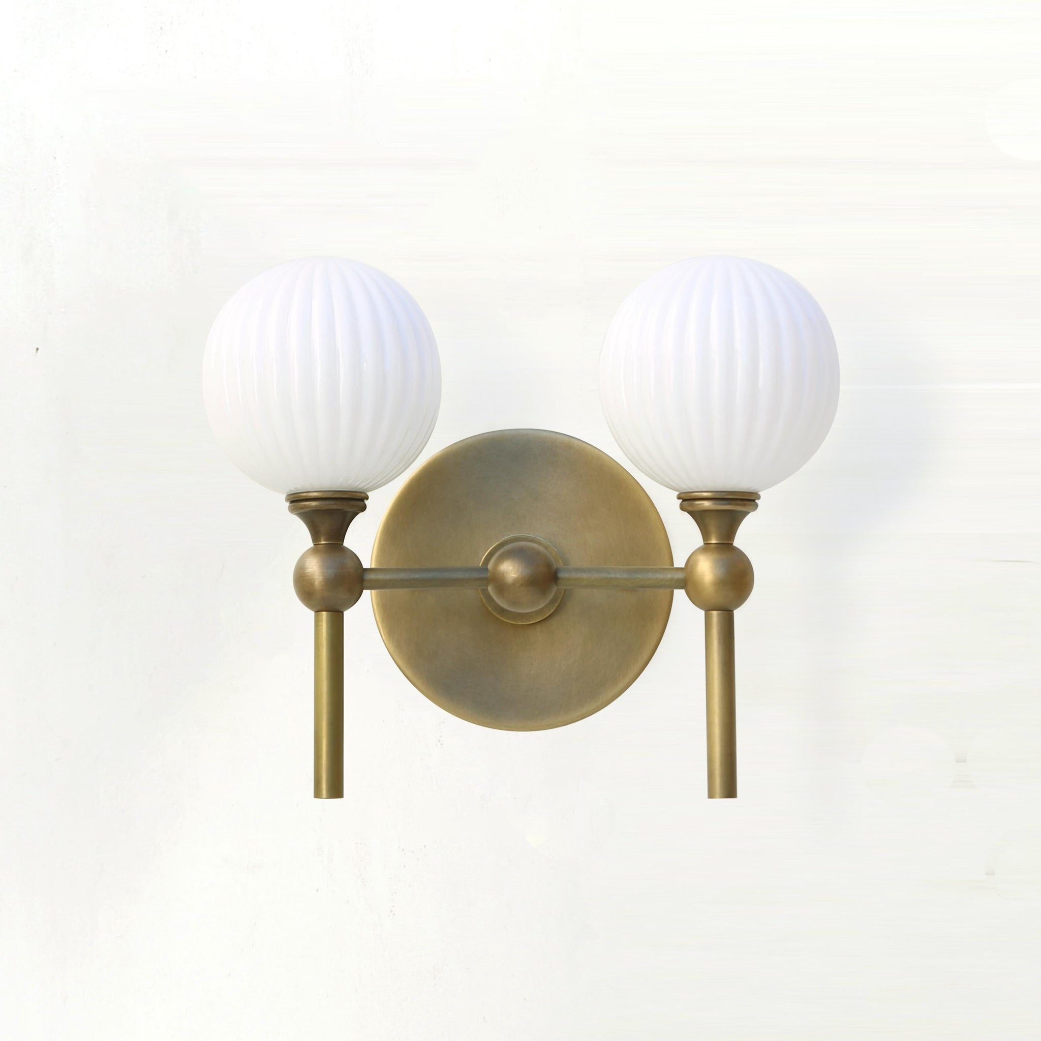 Two-Light Brass Wall Sconce with Ribbed Opal Globes