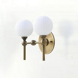 Two-Light Brass Wall Sconce with Ribbed Opal Globes