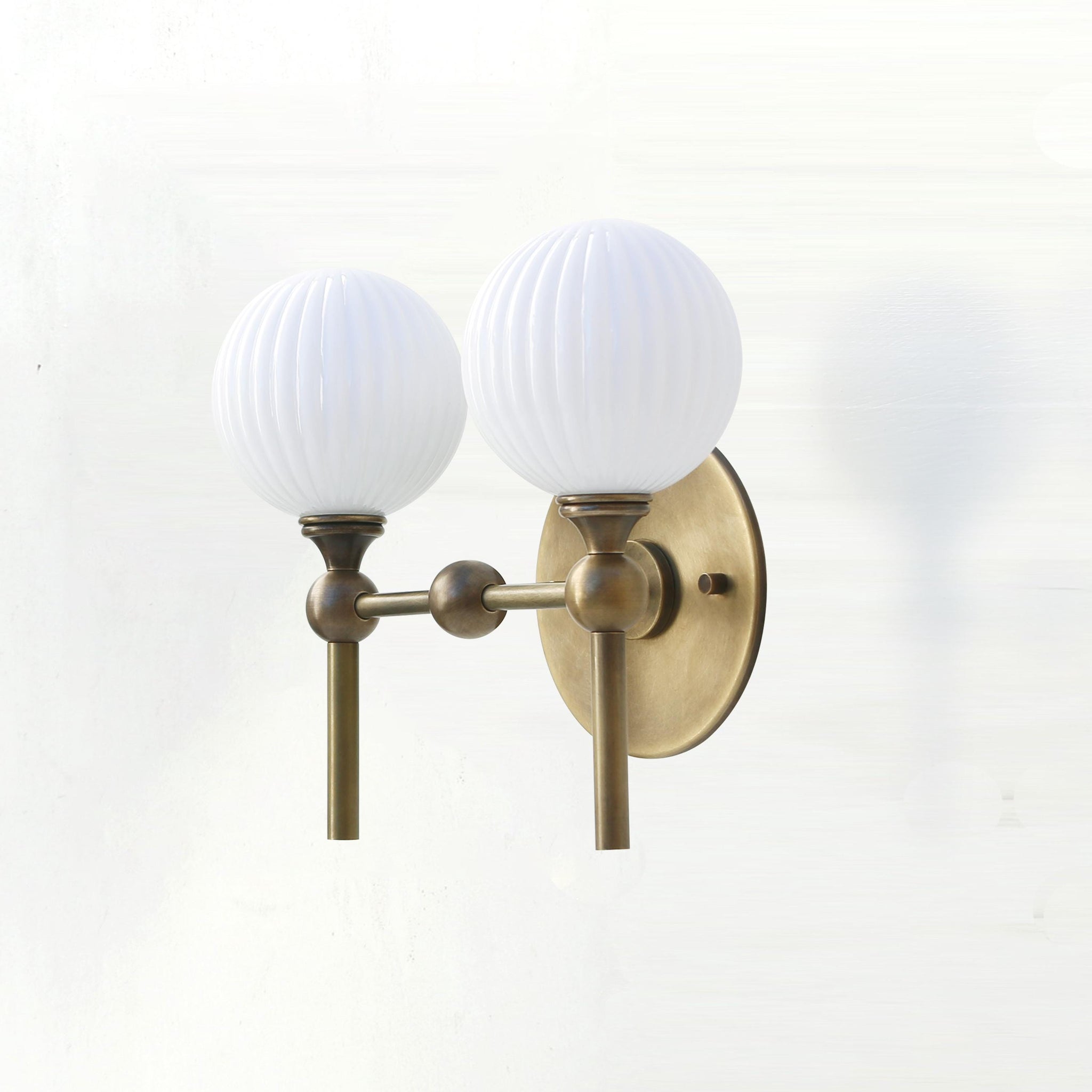 Two-Light Brass Wall Sconce with Ribbed Opal Globes