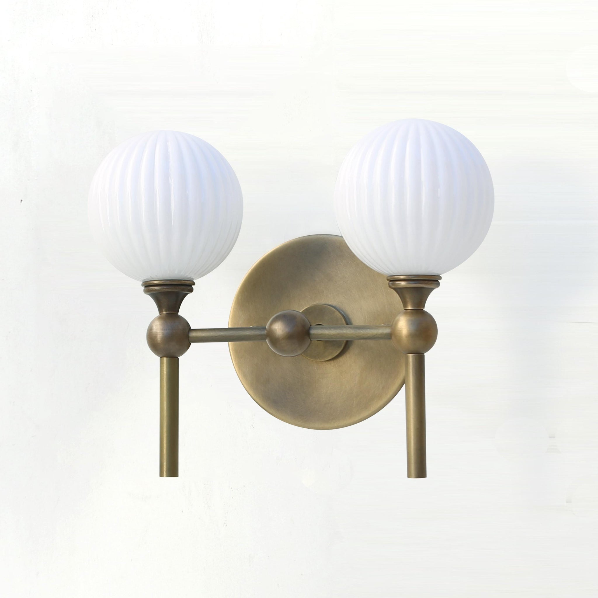 Two-Light Brass Wall Sconce with Ribbed Opal Globes