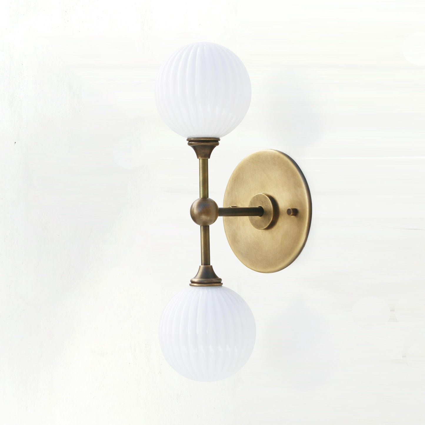 Two-Light Brass Wall Sconce with Stacked Ribbed Opal Globes
