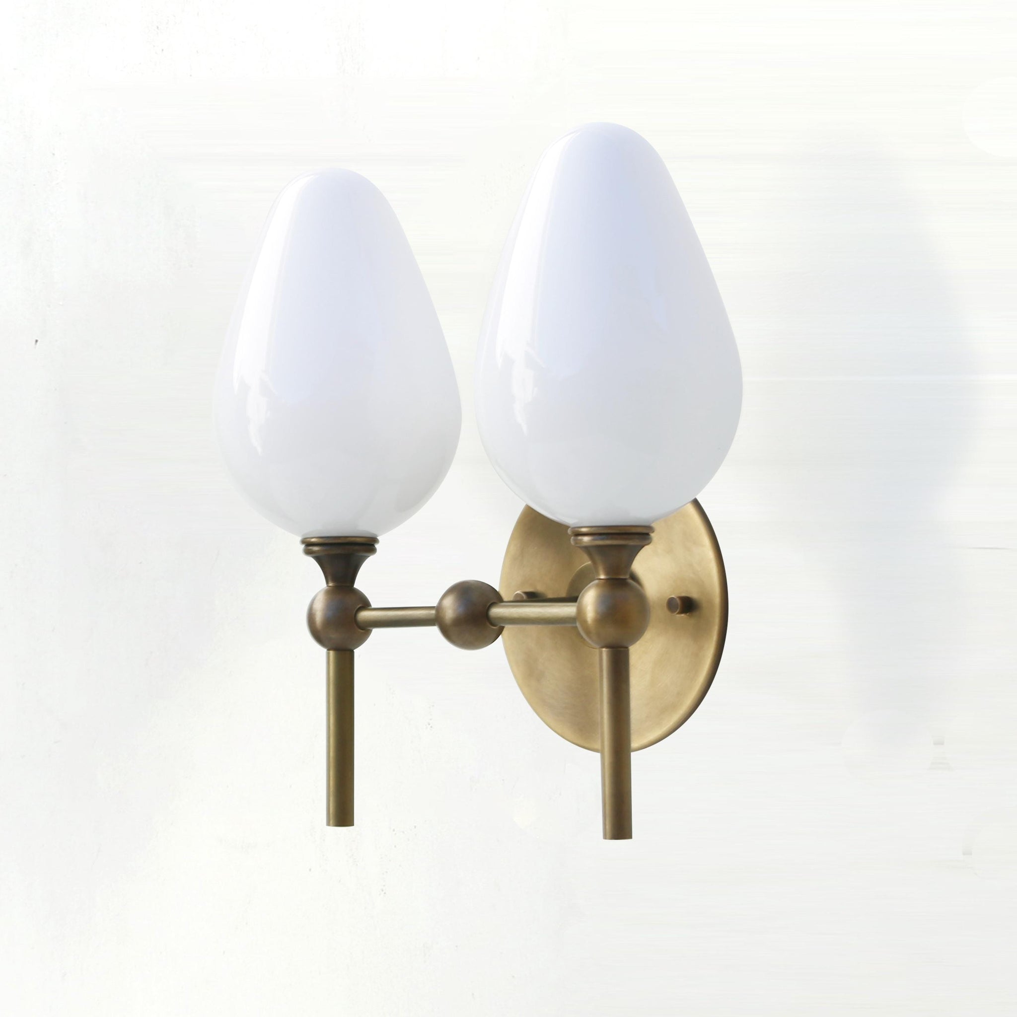 Two-Light Brass Wall Sconce with Upward Opal Tulip Shades