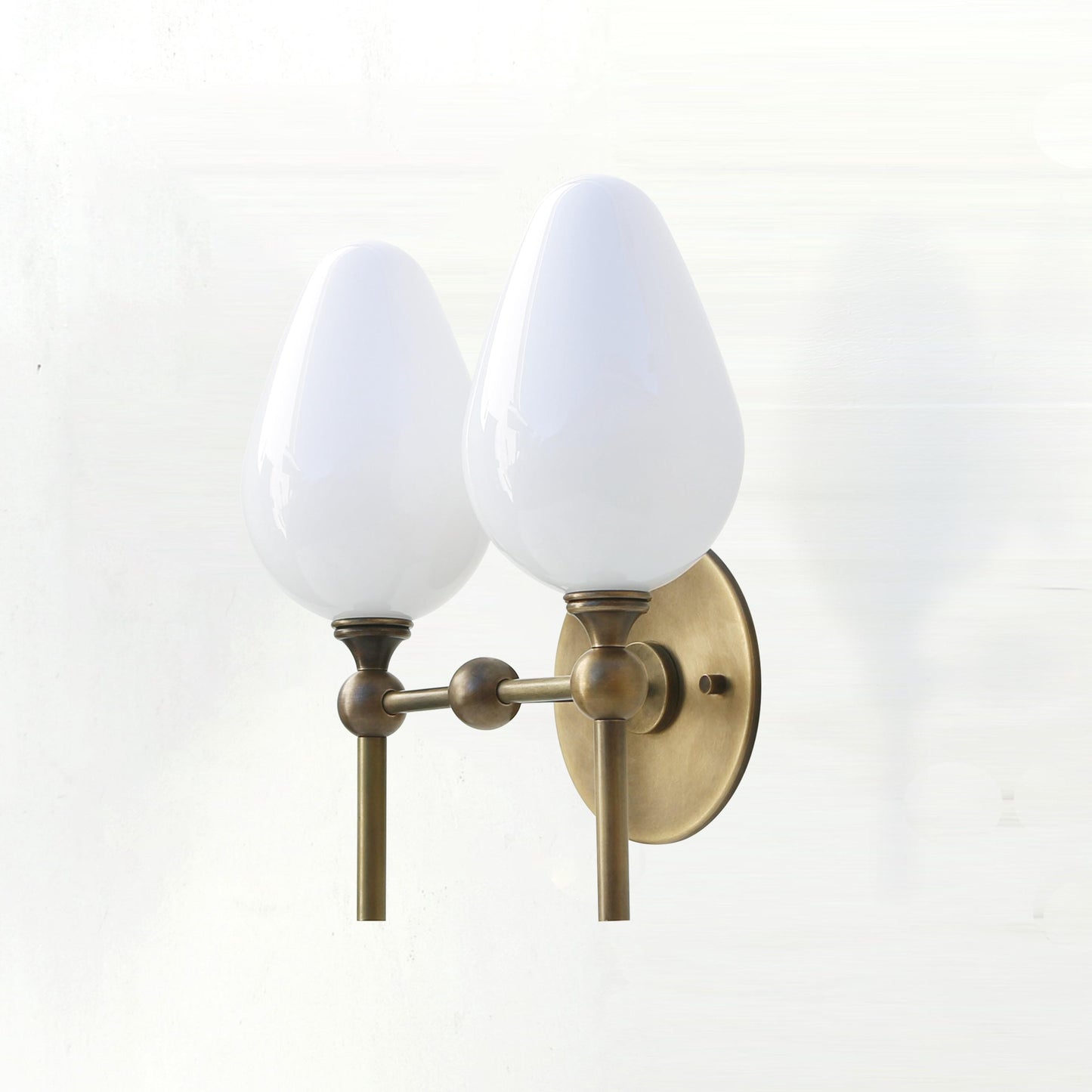 Two-Light Brass Wall Sconce with Upward Opal Tulip Shades