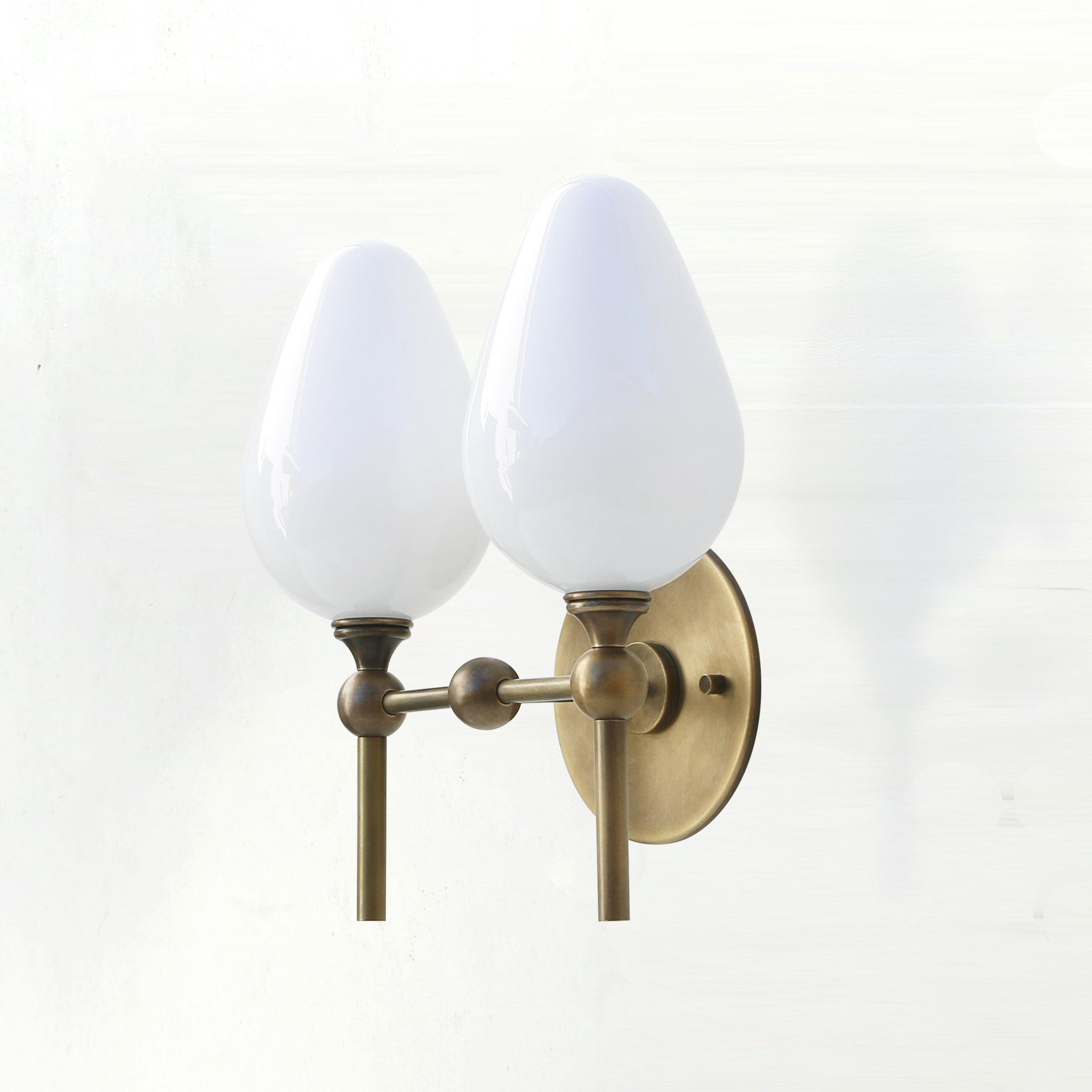 Two-Light Brass Wall Sconce with Upward Opal Tulip Shades