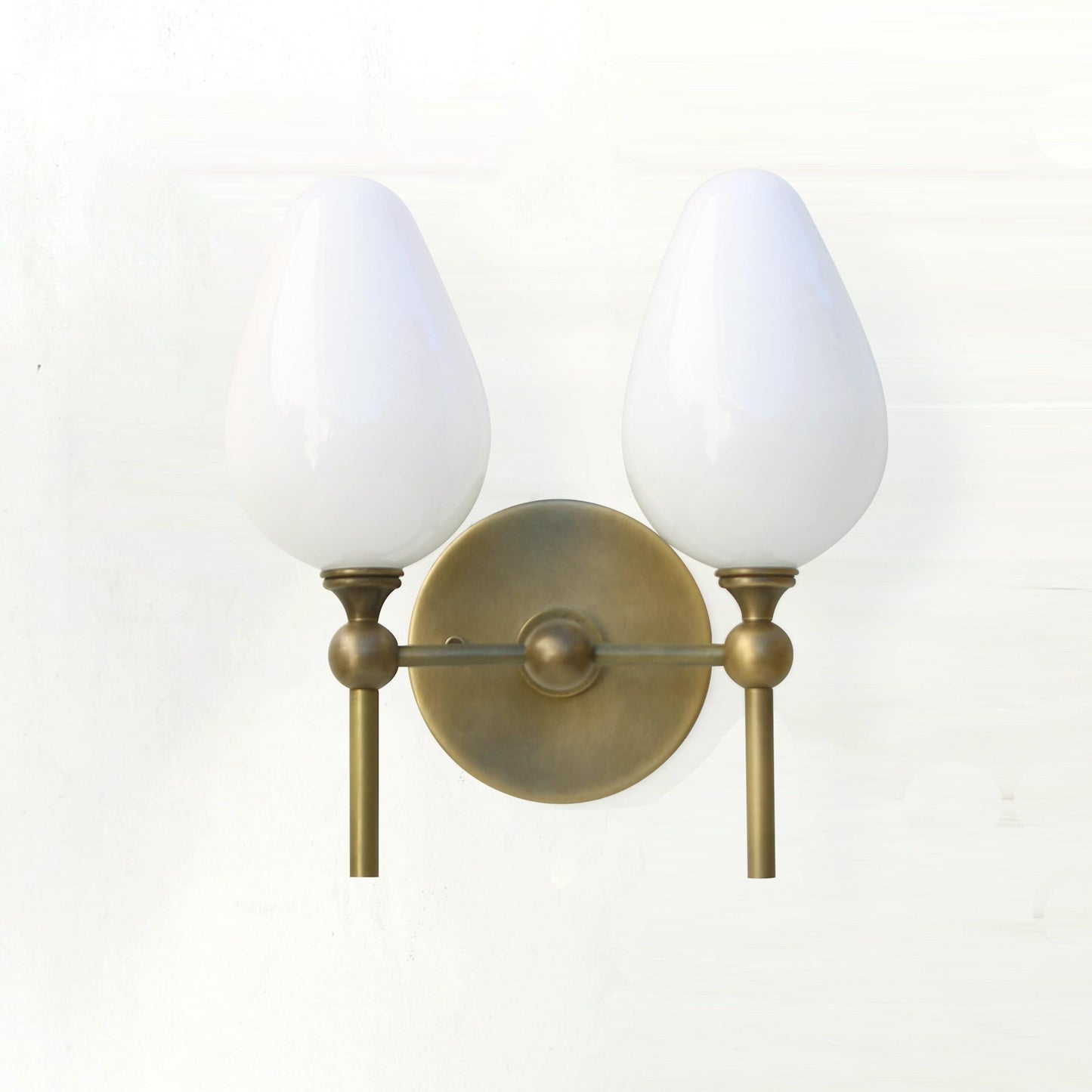 Two-Light Brass Wall Sconce with Upward Opal Tulip Shades