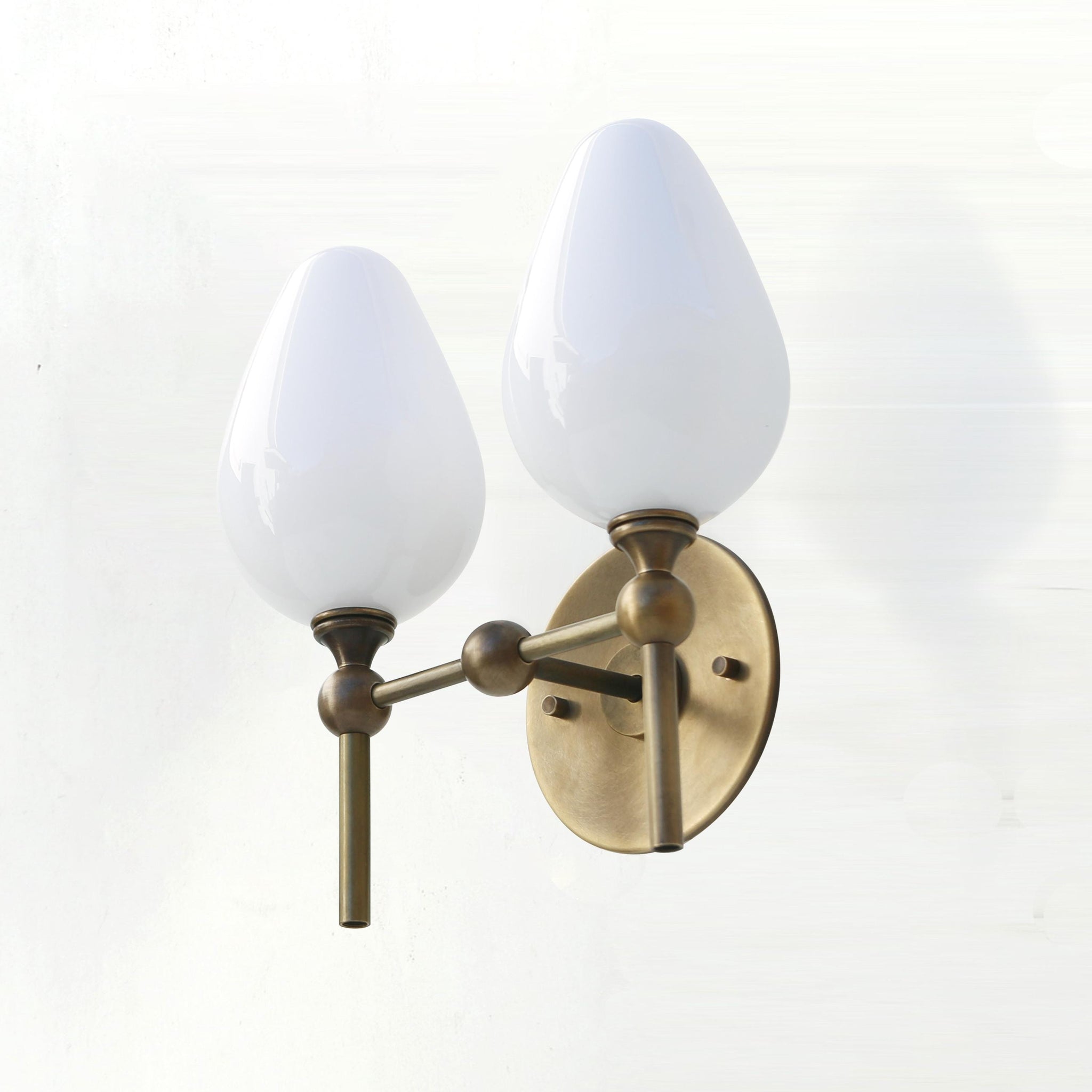 Two-Light Brass Wall Sconce with Upward Opal Tulip Shades