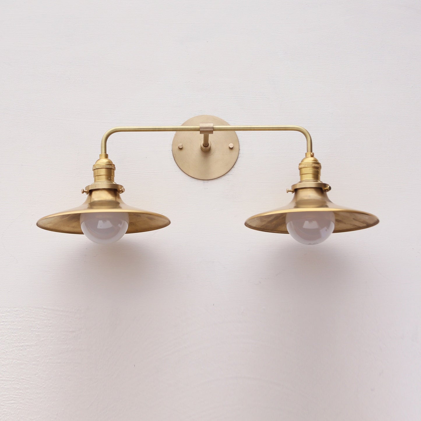 Two-Light Brass Wall Sconce with Wide Coolie Shades