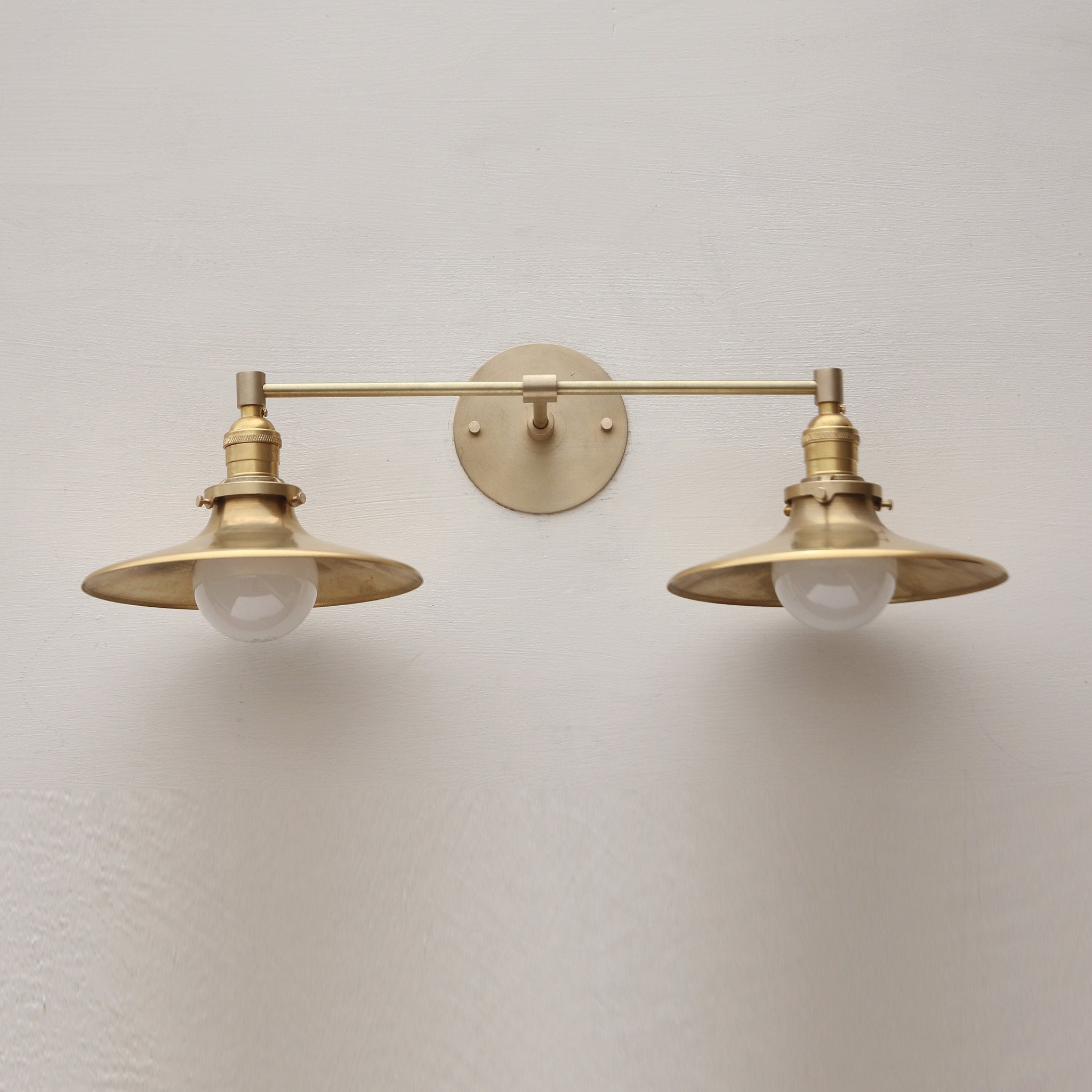 Two-Light Brass Wall Sconce with Wide Saucer Shades