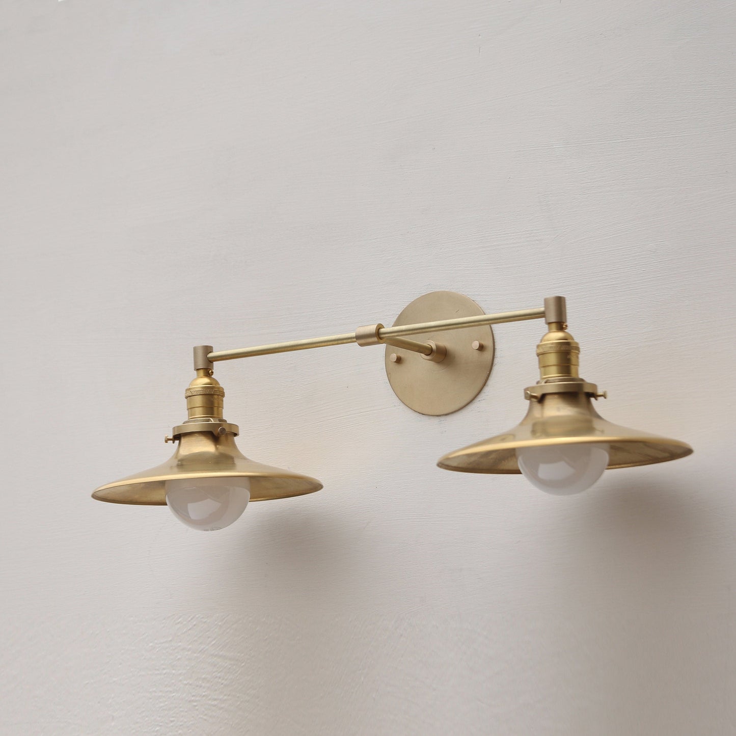 Two-Light Brass Wall Sconce with Wide Saucer Shades
