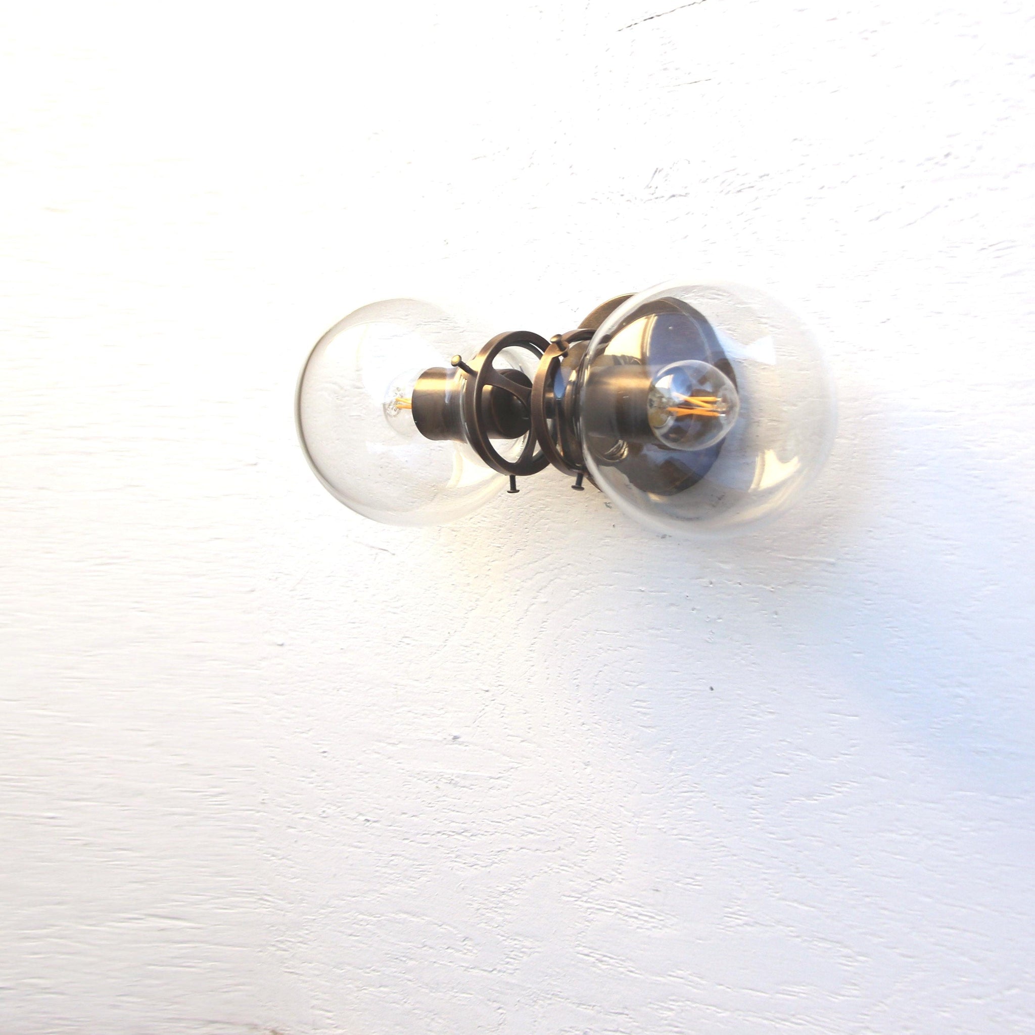 Two-Light Clear Glass Globe Vanity Wall Sconce
