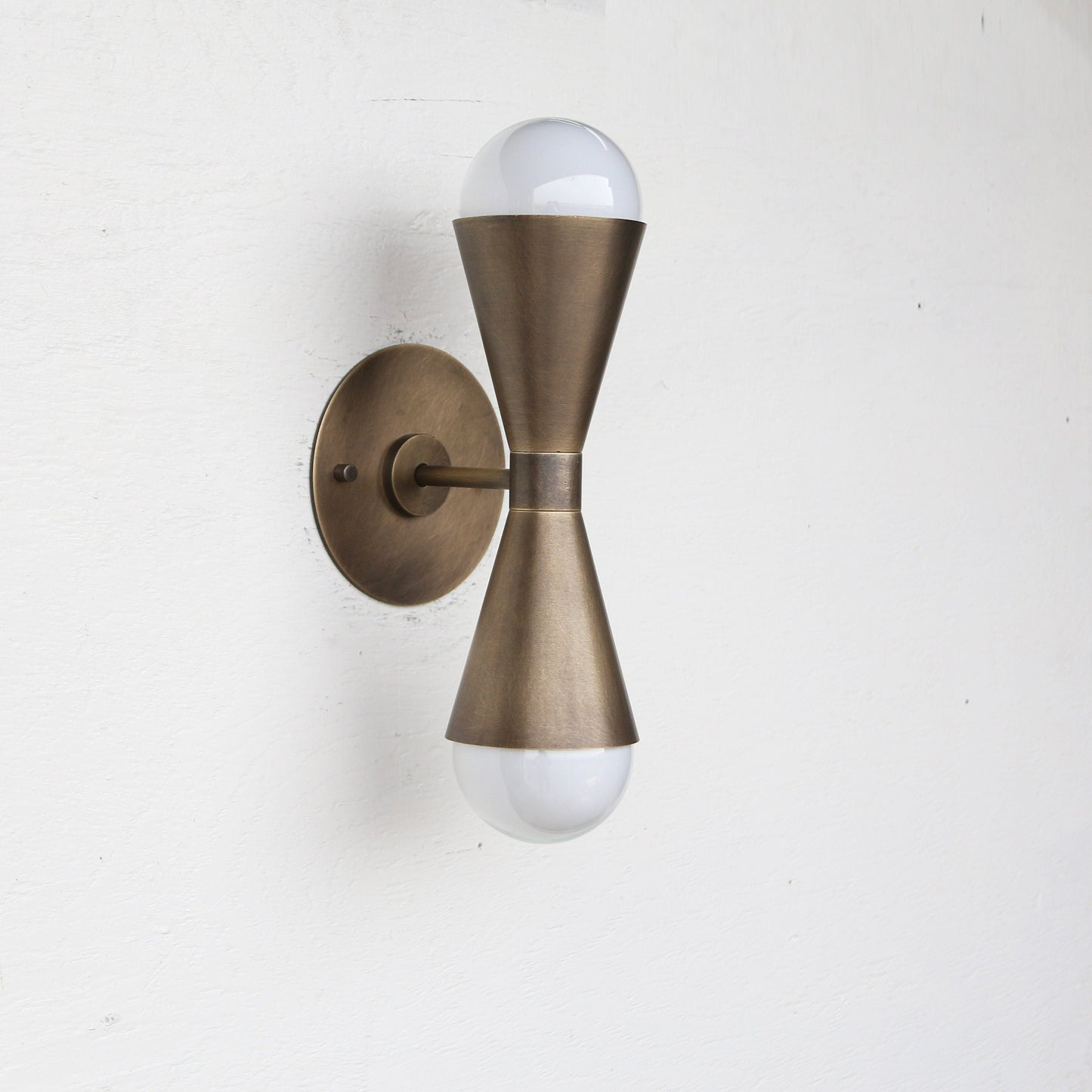 Two-Light Double Cone Wall Sconce in Solid Brass