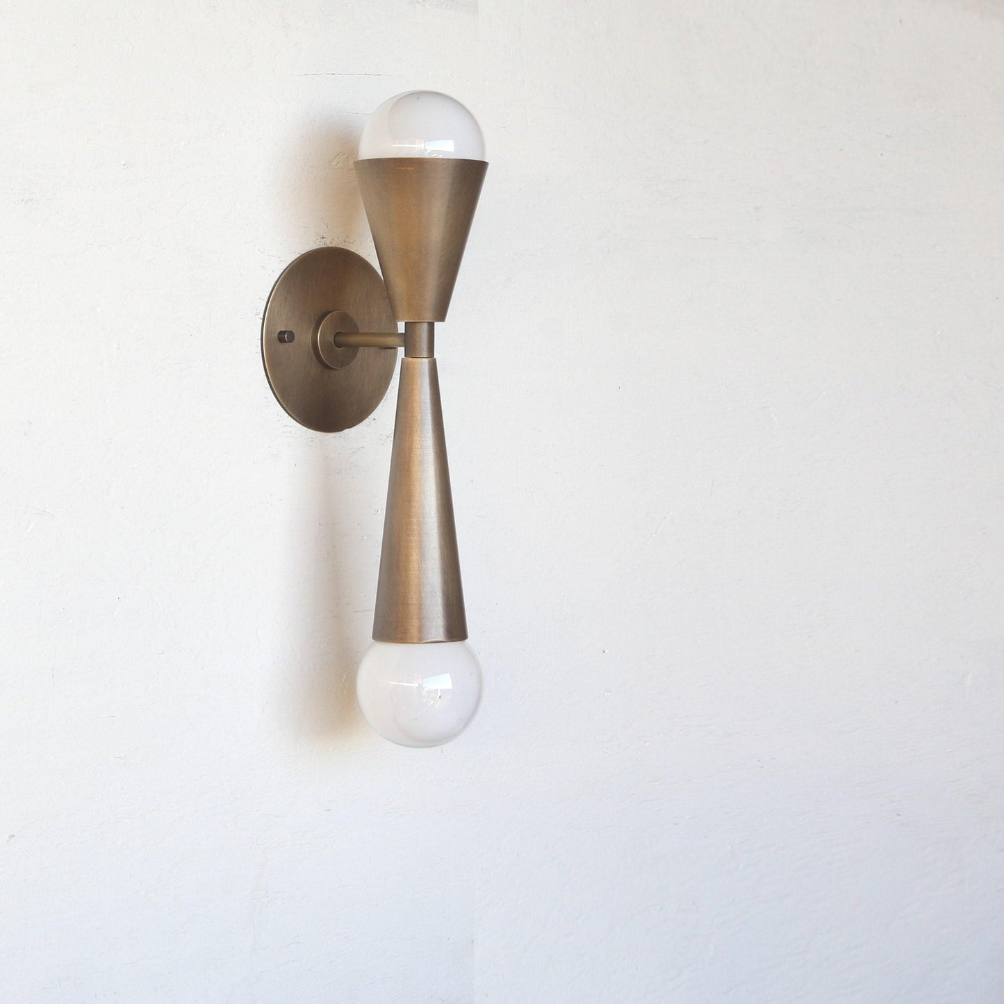 Two-Light Hourglass Brass Cone Wall Sconce