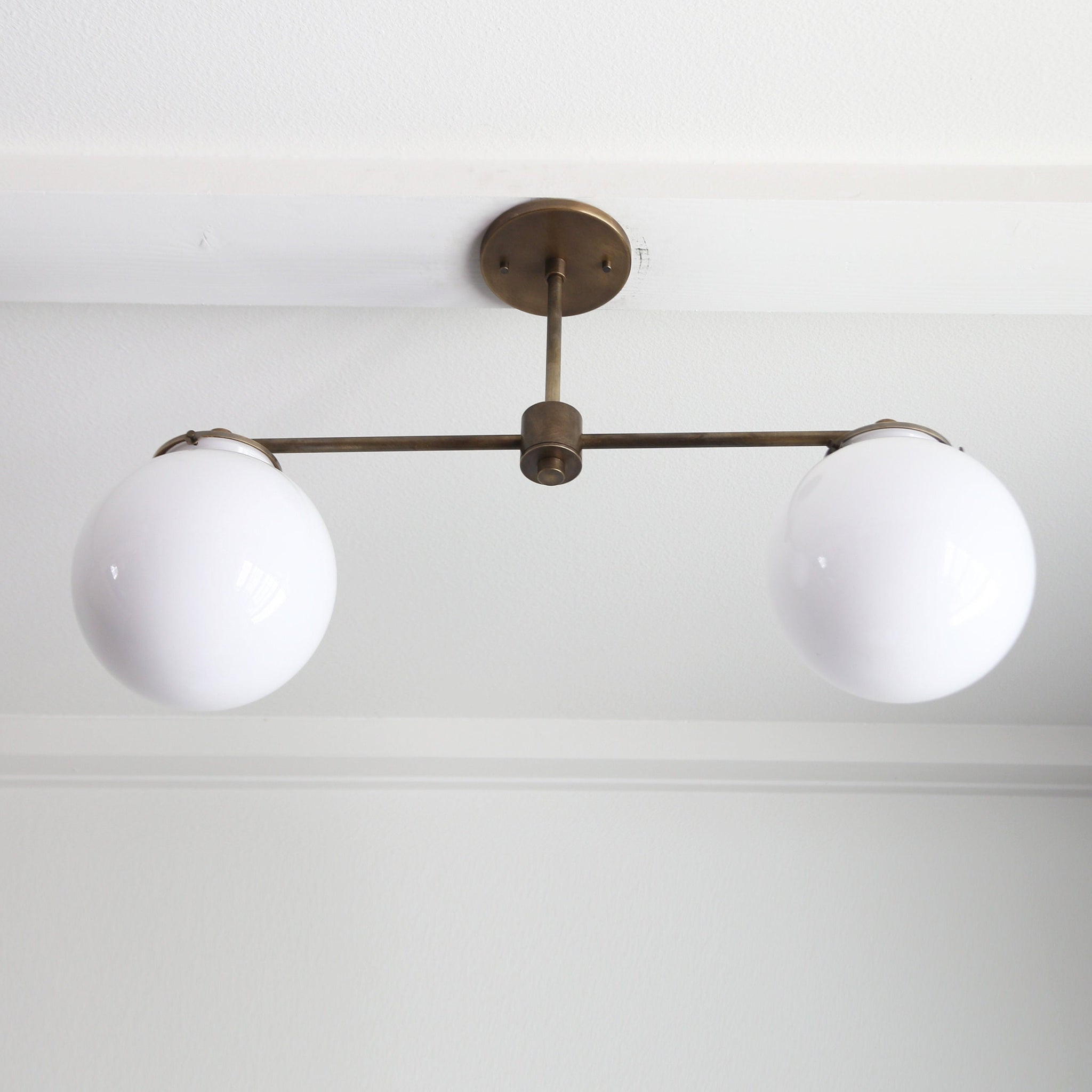 Two-Light Linear Chandelier with Opal Glass Globes