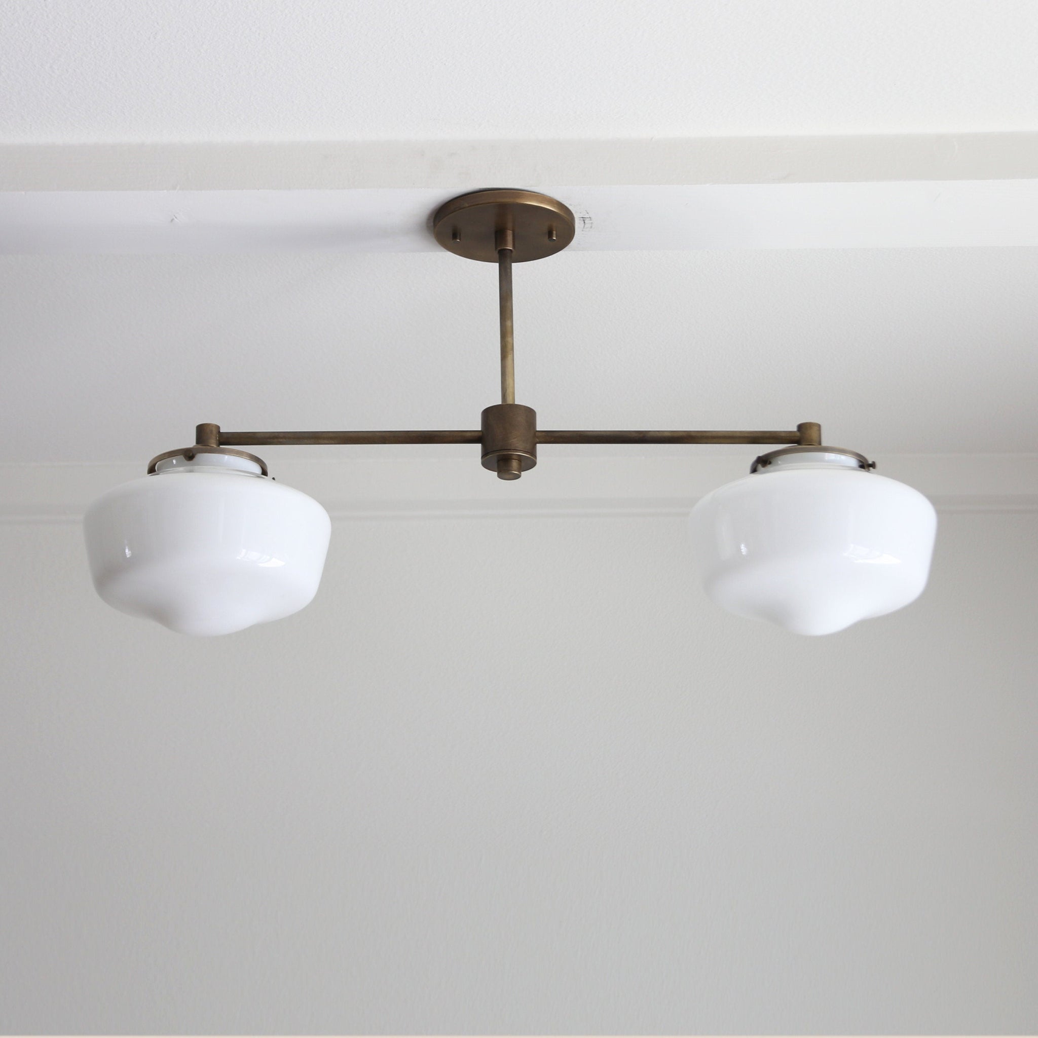 Two-Light Linear Chandelier with Schoolhouse Glass Shades