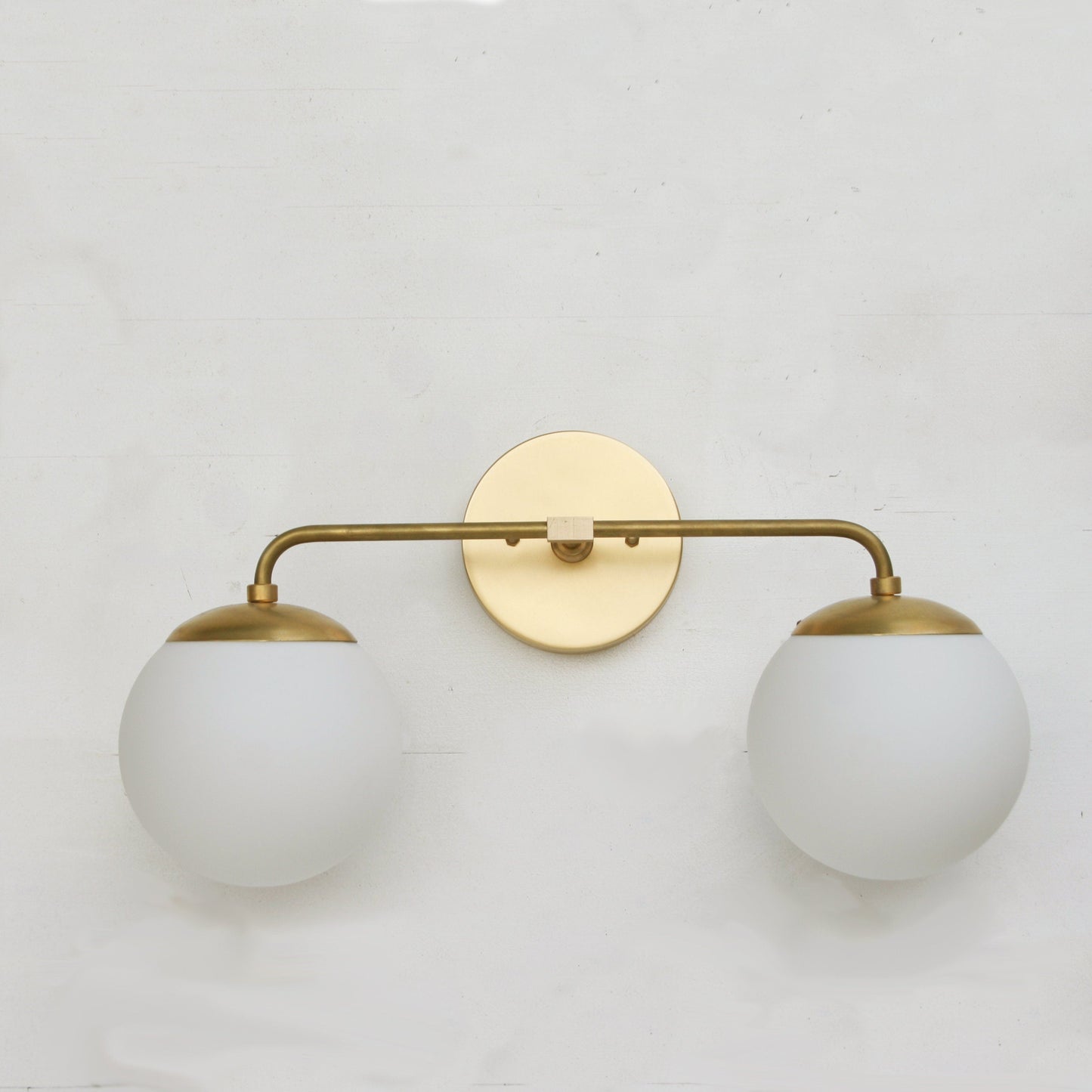 Two-Light Opal Globe Bathroom Vanity Wall Sconce