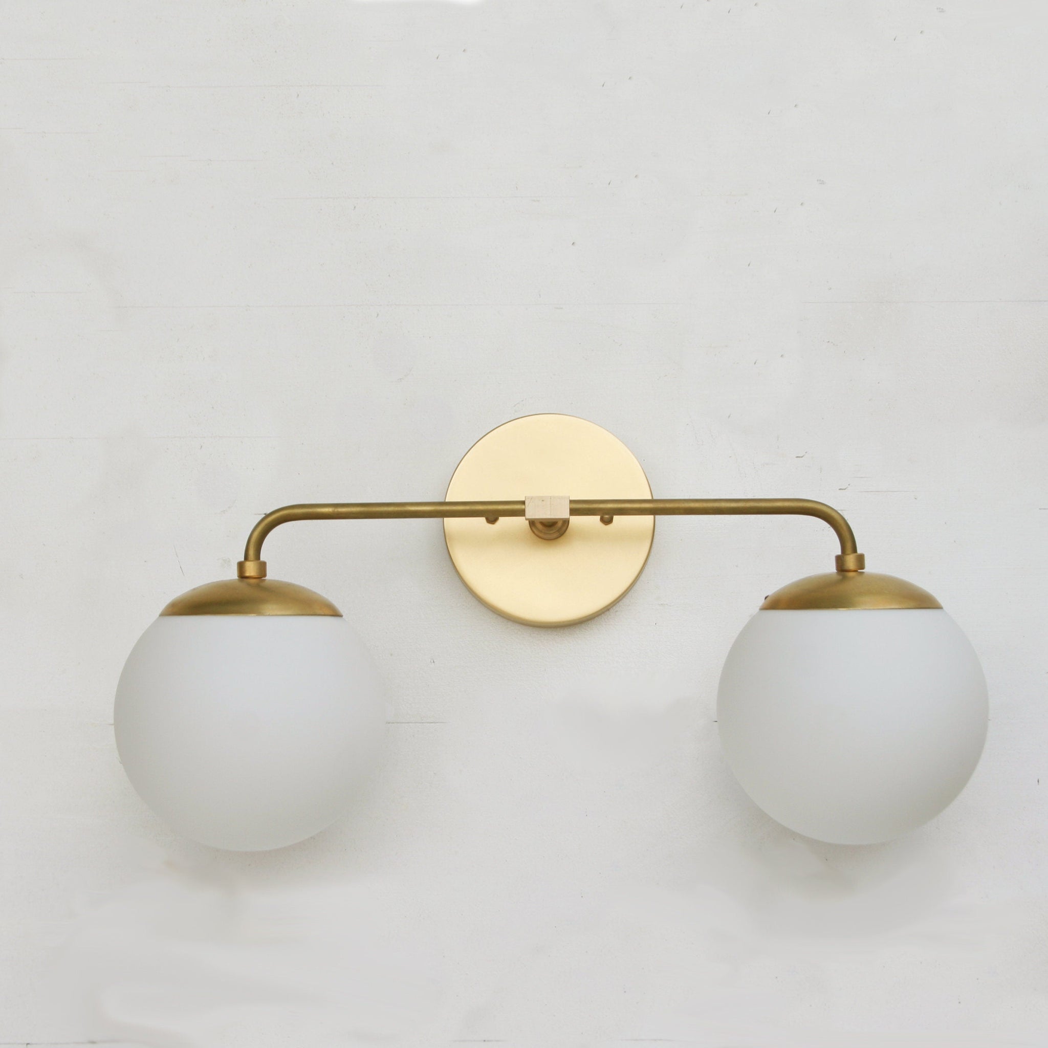 Two-Light Opal Globe Bathroom Vanity Wall Sconce
