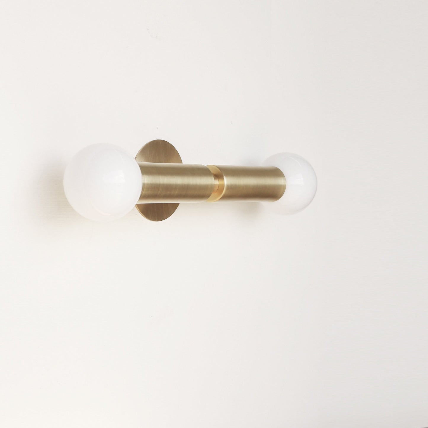 Two-Light Opal Globe Wall Sconce with Vertical Brass Arms