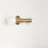 Two-Light Opal Globe Wall Sconce with Vertical Brass Arms