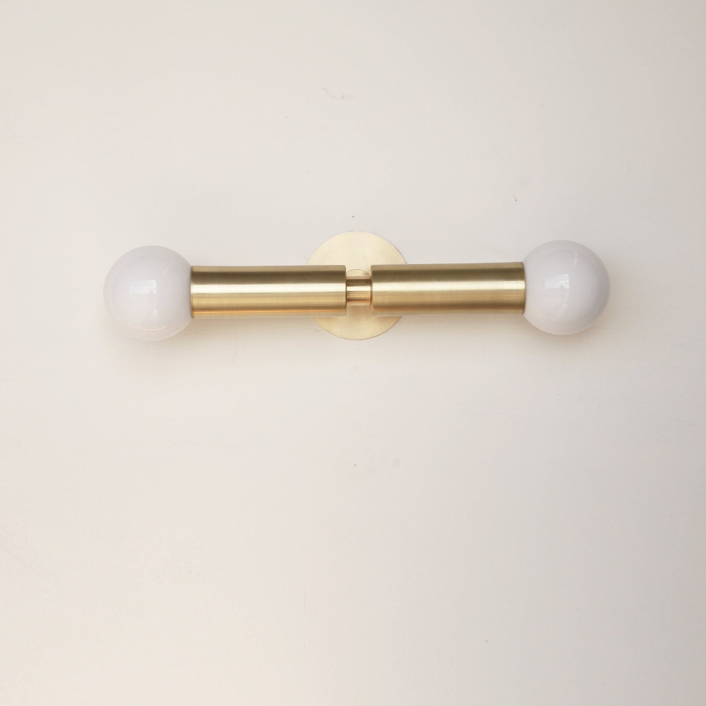 Two-Light Opal Globe Wall Sconce with Vertical Brass Arms