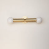 Two-Light Opal Globe Wall Sconce with Vertical Brass Arms