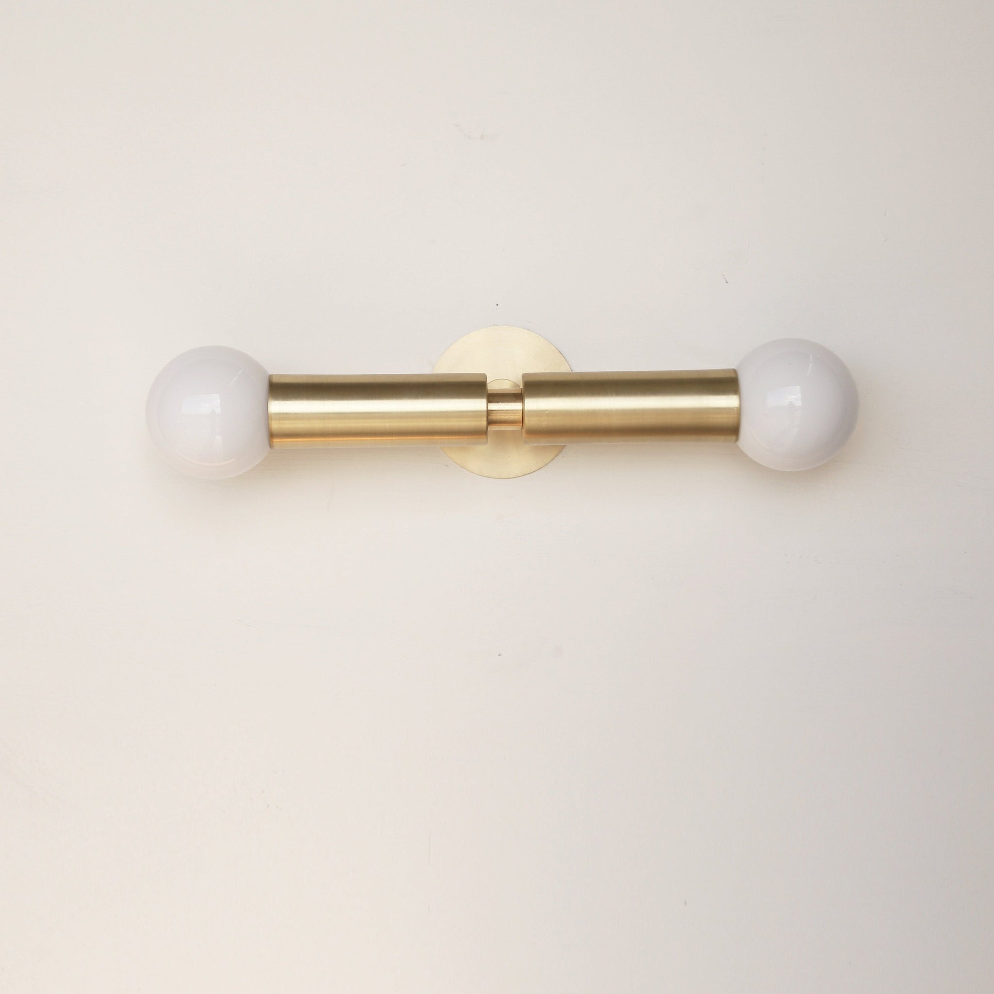 Two-Light Opal Globe Wall Sconce with Vertical Brass Arms