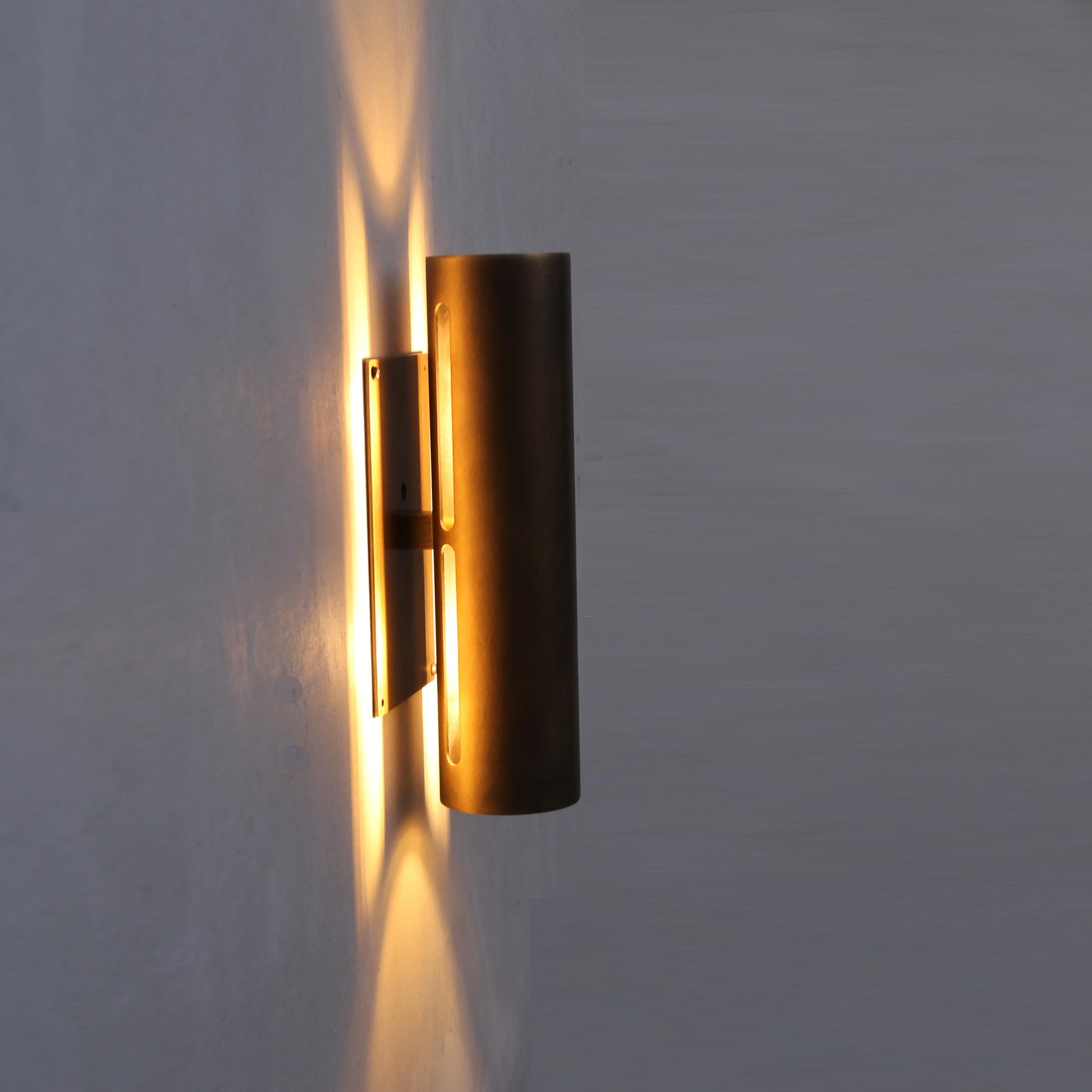 Two-Light Slotted Brass Cylinder Wall Sconce with Cast Square Backplate