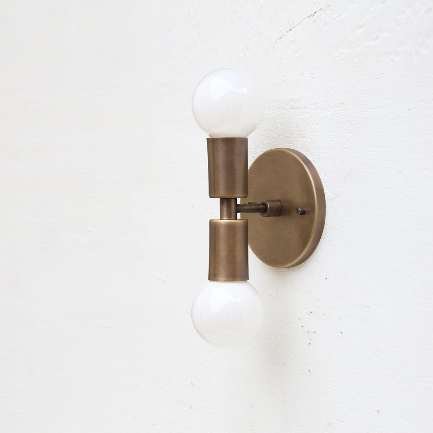 Two-Light Stacked Brass Wall Sconce with Exposed Bulbs