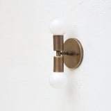 Two-Light Stacked Brass Wall Sconce with Exposed Bulbs
