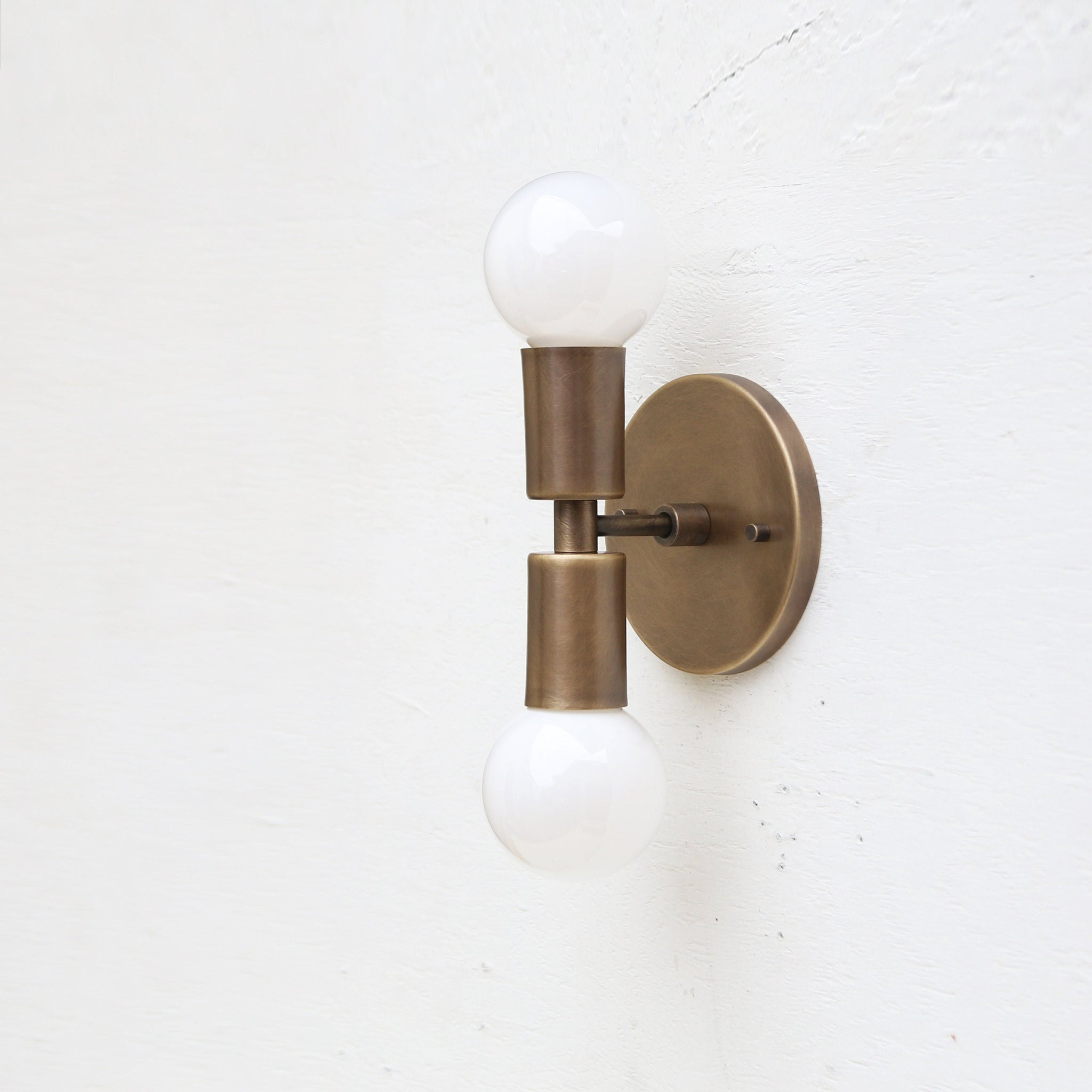 Two-Light Stacked Brass Wall Sconce with Exposed Bulbs