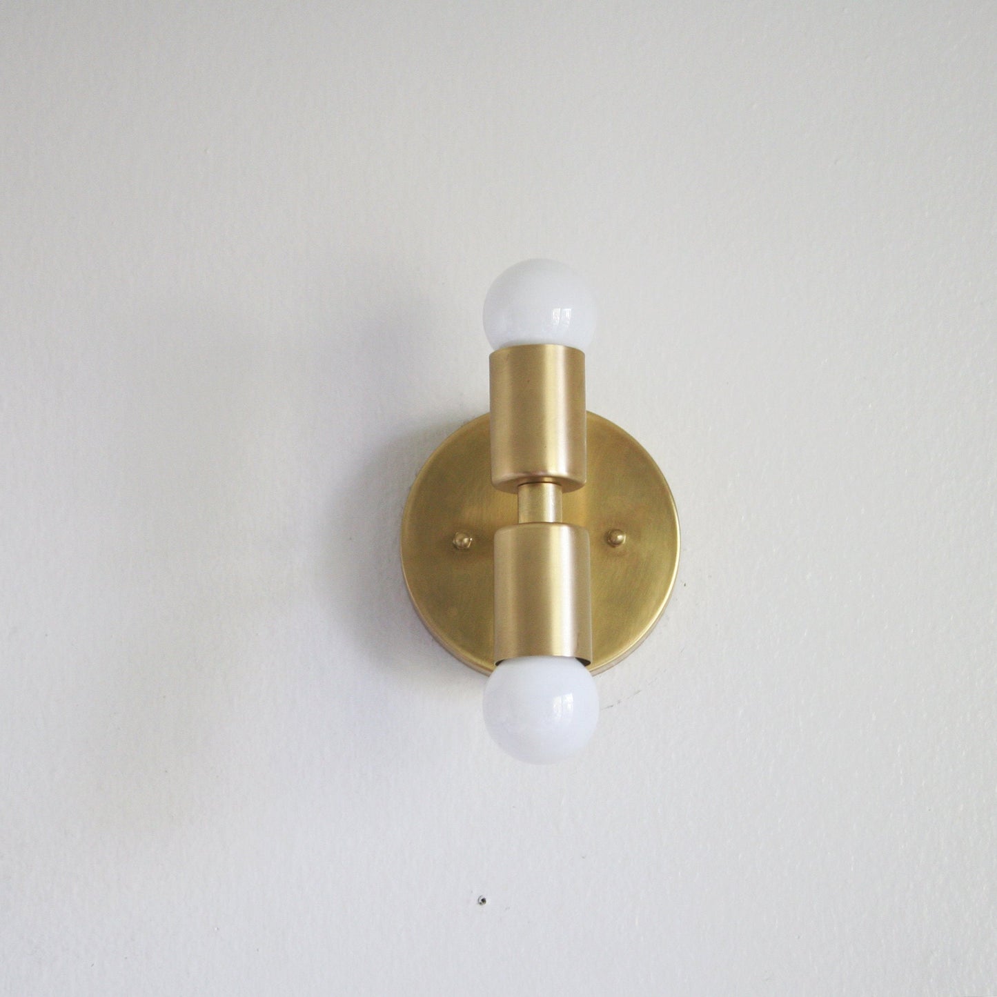 Two-Light Stacked Brass Wall Sconce with Exposed Bulbs