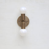 Two-Light Stacked Brass Wall Sconce with Exposed Bulbs