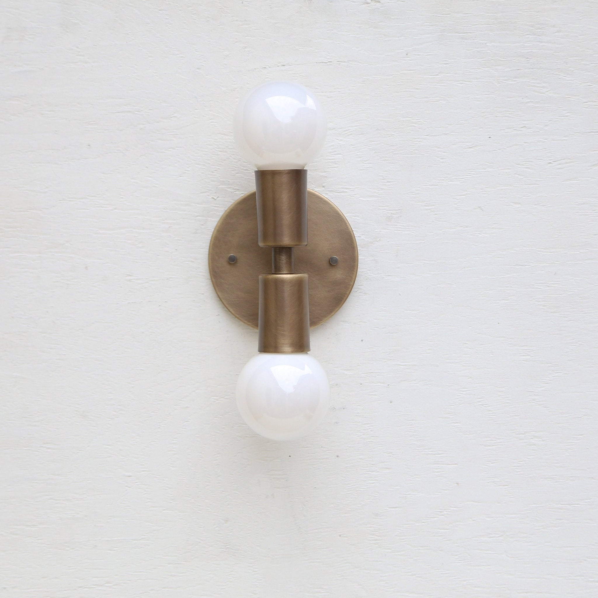 Two-Light Stacked Brass Wall Sconce with Exposed Bulbs