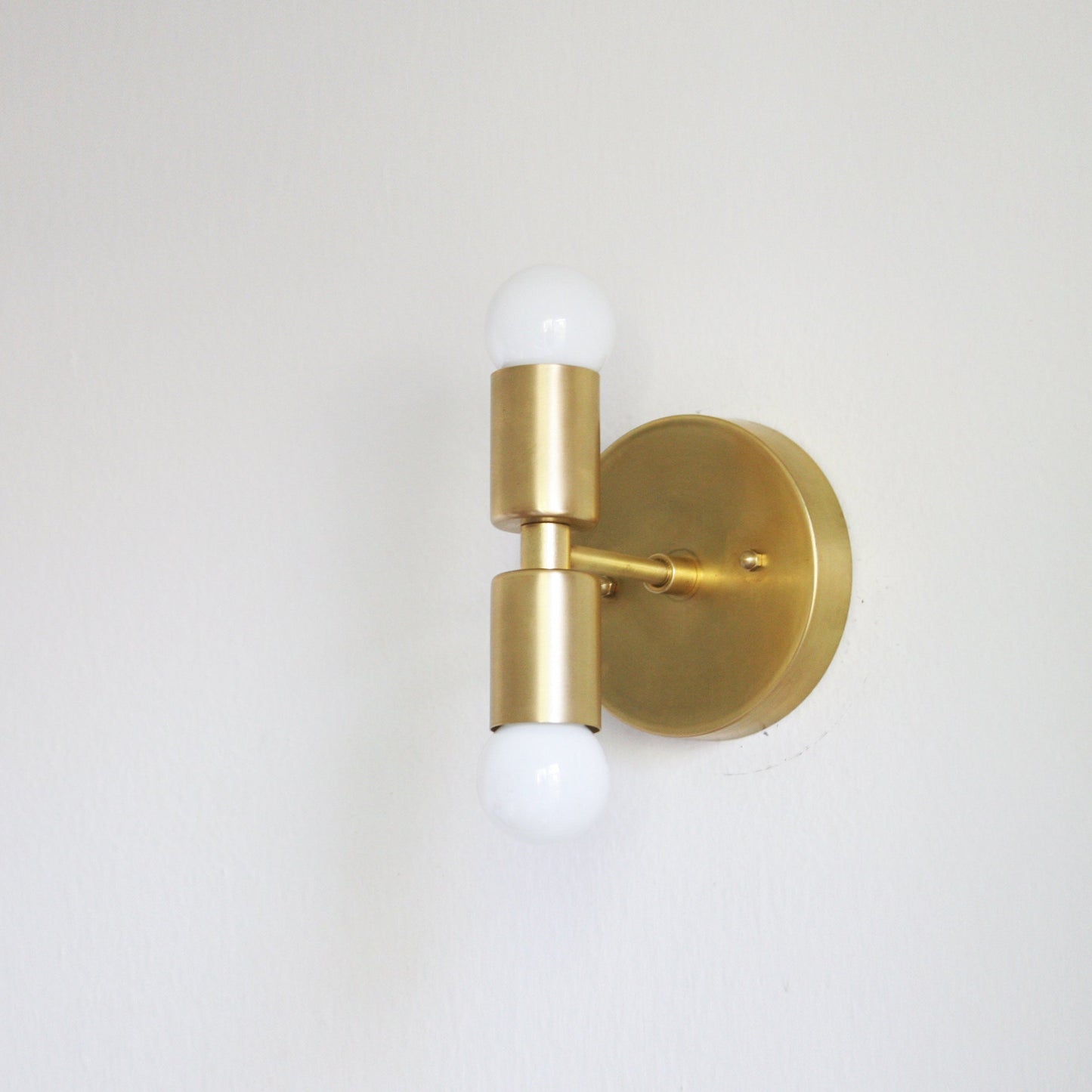 Two-Light Stacked Brass Wall Sconce with Exposed Bulbs