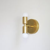 Two-Light Stacked Brass Wall Sconce with Exposed Bulbs