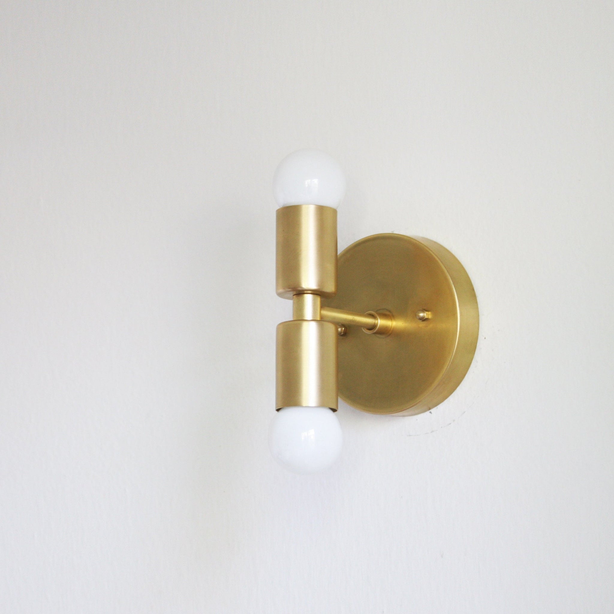 Two-Light Stacked Brass Wall Sconce with Exposed Bulbs