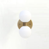 Two-Light Vertical Brass Wall Sconce with Ribbed Opal Globes