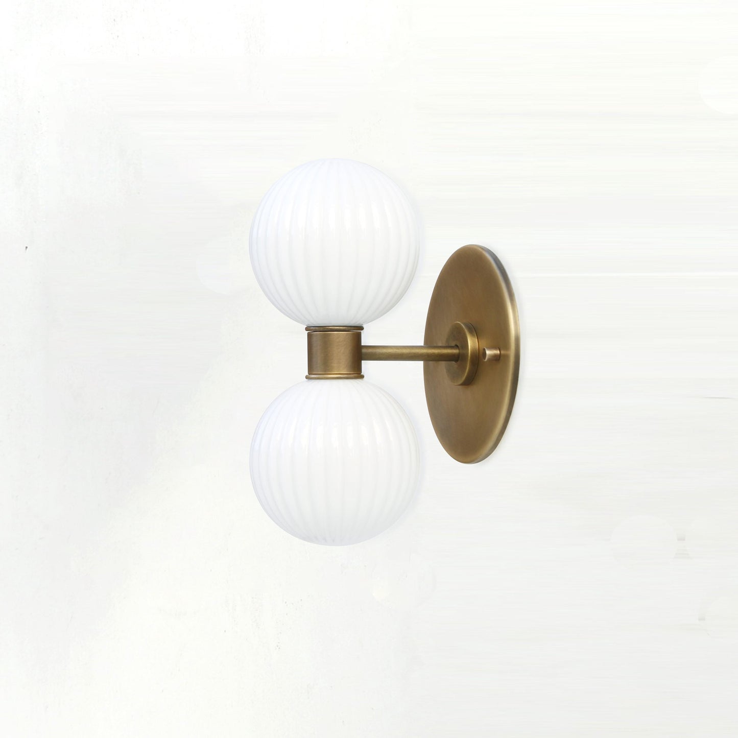 Two-Light Vertical Brass Wall Sconce with Ribbed Opal Globes